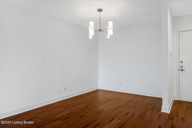 5800 Coach Gate Wynde Unit 312D, Louisville, KY 40207 - spare room featuring a chandelier and wood finished floors