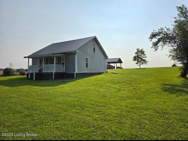 1515 Concord Rd, Falls Of Rough, KY 40119 - view of home's exterior featuring a porch, a yard, and a metal roof