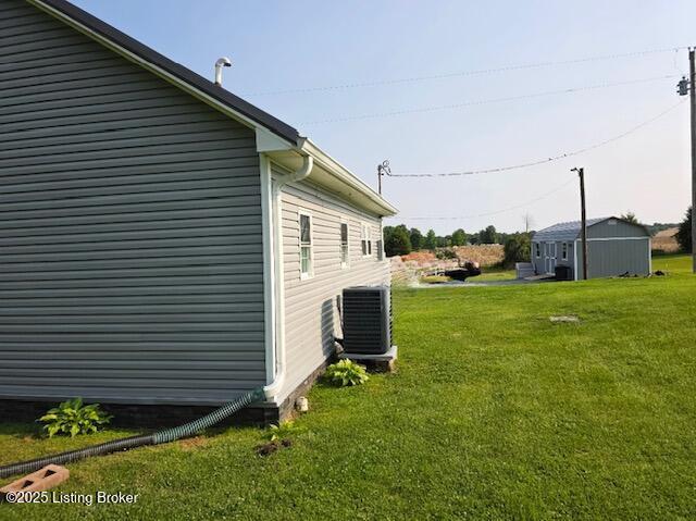 1515 Concord Rd, Falls Of Rough, KY 40119 - view of home's exterior featuring a yard and a cooling unit