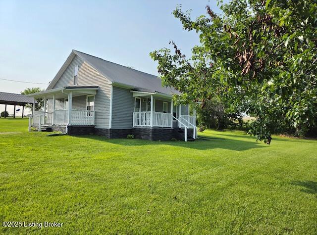 1515 Concord Rd, Falls Of Rough, KY 40119 - view of home's exterior featuring covered porch and a lawn