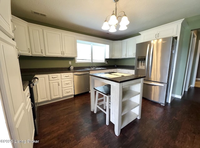 1515 Concord Rd, Falls Of Rough, KY 40119 - kitchen featuring stainless steel appliances, open shelves, and white cabinetry
