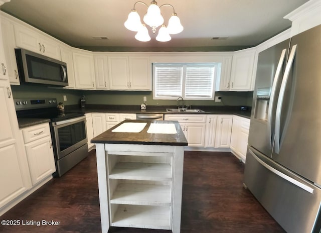 1515 Concord Rd, Falls Of Rough, KY 40119 - kitchen with appliances with stainless steel finishes, open shelves, a chandelier, and white cabinets