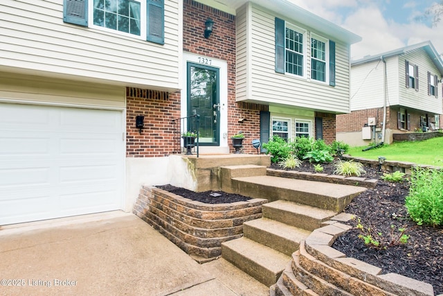 7327 Sideoats Dr, Crestwood, KY 40014 - view of exterior entry with brick siding and a garage