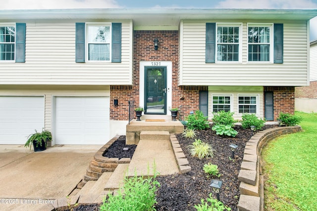 7327 Sideoats Dr, Crestwood, KY 40014 - view of front of property with brick siding, driveway, and a garage