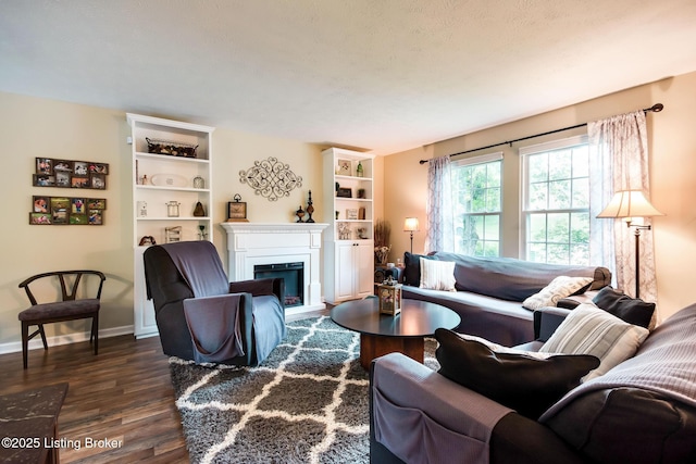 7327 Sideoats Dr, Crestwood, KY 40014 - living room featuring dark wood finished floors, a fireplace, and a textured ceiling