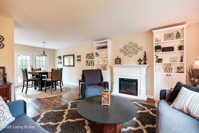 7327 Sideoats Dr, Crestwood, KY 40014 - living area with dark wood-type flooring and a glass covered fireplace