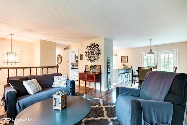 7327 Sideoats Dr, Crestwood, KY 40014 - living room with a chandelier and dark wood-style flooring