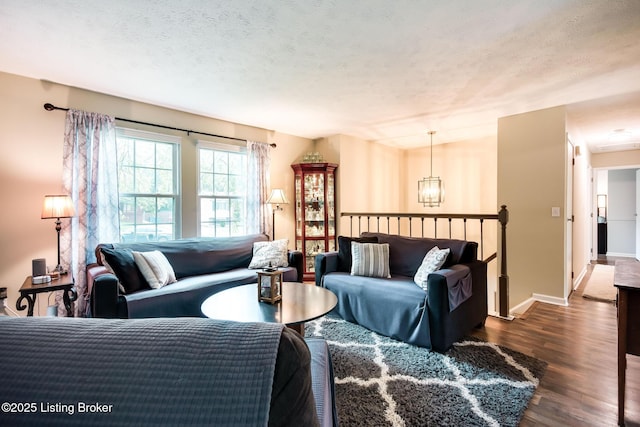 7327 Sideoats Dr, Crestwood, KY 40014 - living area featuring dark wood-style flooring and a textured ceiling