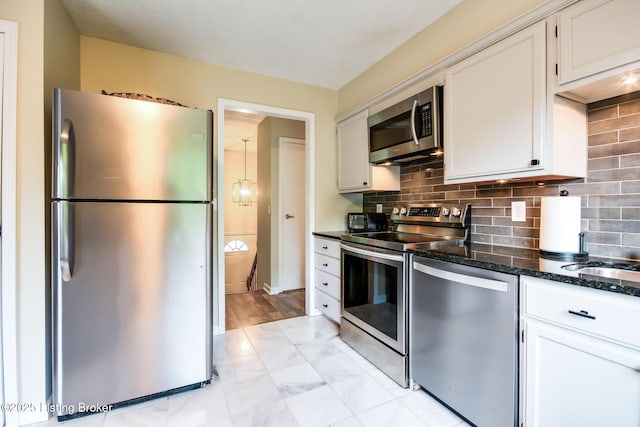 7327 Sideoats Dr, Crestwood, KY 40014 - kitchen with appliances with stainless steel finishes, dark stone countertops, decorative backsplash, and white cabinets