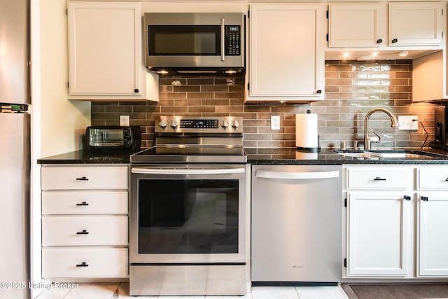 7327 Sideoats Dr, Crestwood, KY 40014 - kitchen with appliances with stainless steel finishes, dark stone counters, and tasteful backsplash