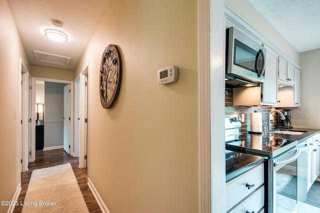 7327 Sideoats Dr, Crestwood, KY 40014 - hallway with dark wood-style floors and attic access
