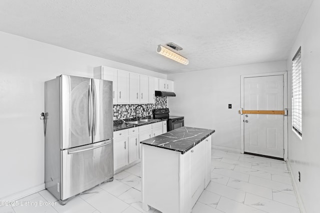 2215 W Jefferson St, Louisville, KY 40212 - kitchen featuring freestanding refrigerator, black electric range, under cabinet range hood, light marble finish flooring, and white cabinetry