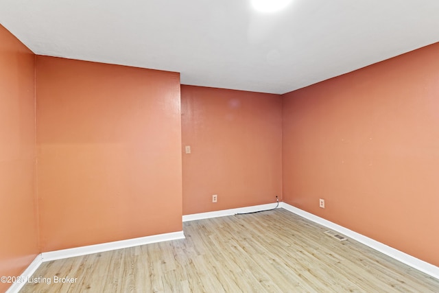 2215 W Jefferson St, Louisville, KY 40212 - empty room with wood finished floors and baseboards