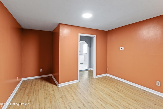 2215 W Jefferson St, Louisville, KY 40212 - spare room featuring light wood-style floors and arched walkways