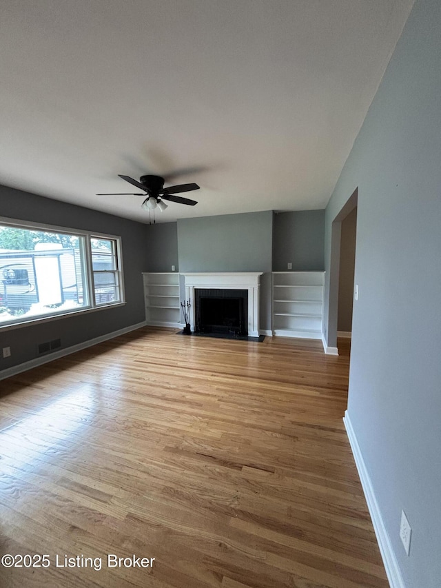 2707 Sharon Way, Louisville, KY 40220 - unfurnished living room with a ceiling fan, wood finished floors, and a fireplace with flush hearth