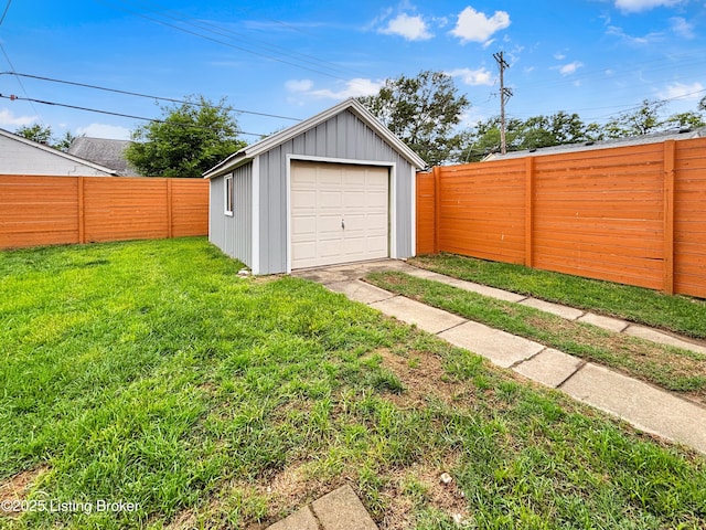 2406 Bradley Ave, Louisville, KY 40217 - detached garage featuring driveway