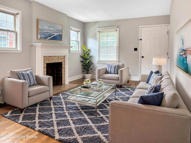 2406 Bradley Ave, Louisville, KY 40217 - living area featuring wood finished floors and a tile fireplace