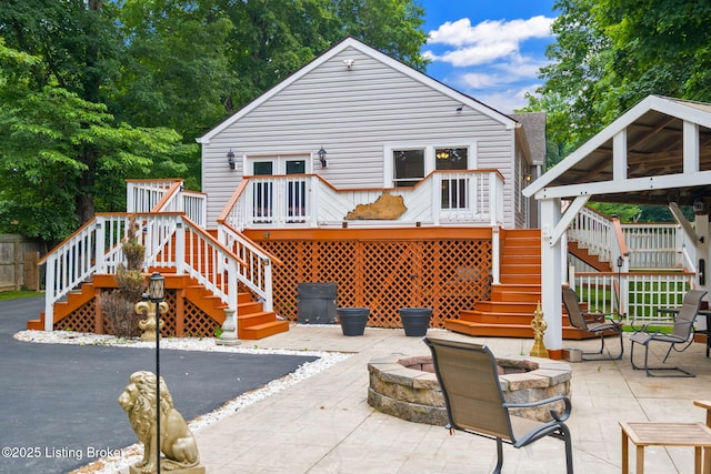 7210 River Rd, Prospect, KY 40059 - back of property featuring stairs, an outdoor fire pit, a deck, and a patio