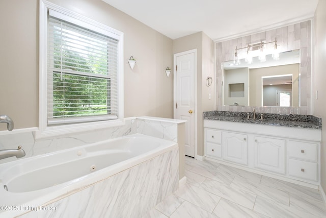 7210 River Rd, Prospect, KY 40059 - bathroom featuring healthy amount of natural light, vanity, a whirlpool tub, and marble look tile flooring