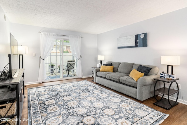 1251 Westlynne Way Apt 2, Louisville, KY 40222 - living room featuring wood finished floors and a textured ceiling
