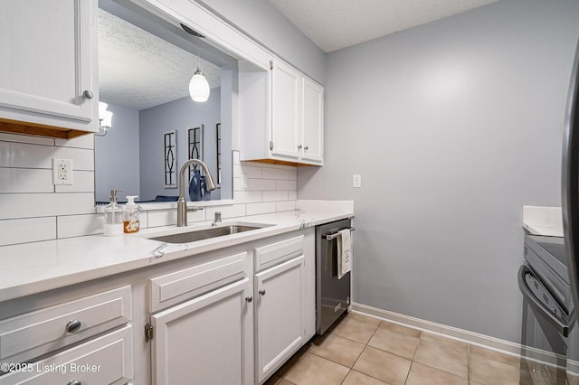 1251 Westlynne Way Apt 2, Louisville, KY 40222 - kitchen featuring dishwasher, a textured ceiling, decorative backsplash, light countertops, and light tile patterned floors