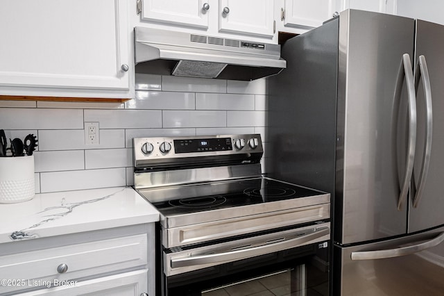 1251 Westlynne Way Apt 2, Louisville, KY 40222 - kitchen featuring stainless steel appliances, under cabinet range hood, backsplash, and white cabinetry