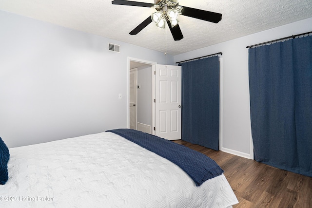 1251 Westlynne Way Apt 2, Louisville, KY 40222 - bedroom with wood finished floors, a textured ceiling, and a ceiling fan