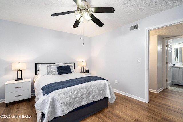 1251 Westlynne Way Apt 2, Louisville, KY 40222 - bedroom with wood finished floors, a textured ceiling, and a ceiling fan
