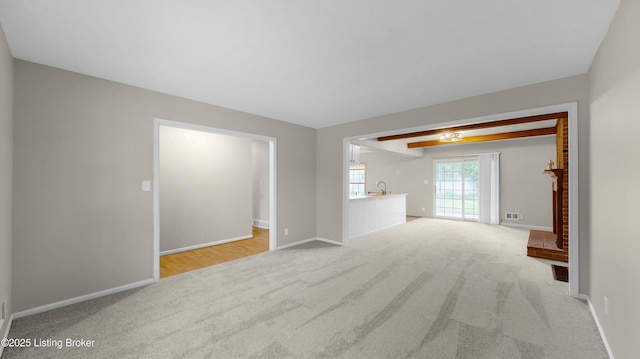 2204 Renown Dr, Jeffersontown, KY 40299 - unfurnished living room featuring carpet and baseboards