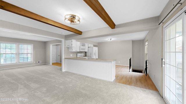 2204 Renown Dr, Jeffersontown, KY 40299 - unfurnished living room featuring light colored carpet and beam ceiling
