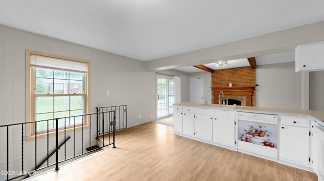 2204 Renown Dr, Jeffersontown, KY 40299 - kitchen featuring light wood-type flooring, white cabinets, light countertops, and dishwasher