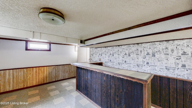 2204 Renown Dr, Jeffersontown, KY 40299 - indoor dry bar featuring a textured ceiling, wainscoting, and wooden walls