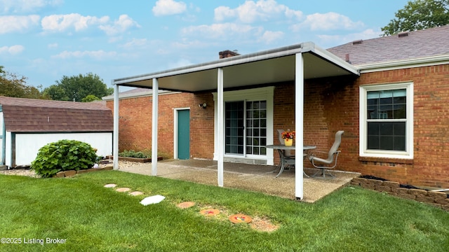 2204 Renown Dr, Jeffersontown, KY 40299 - rear view of house featuring brick siding, a yard, a chimney, a patio area, and a shed