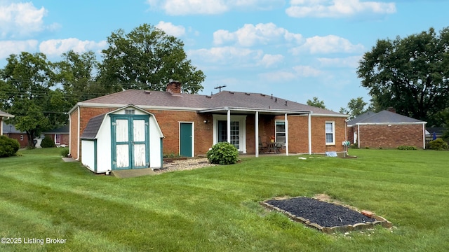 2204 Renown Dr, Jeffersontown, KY 40299 - rear view of house with a storage unit, a yard, a chimney, a patio area, and brick siding