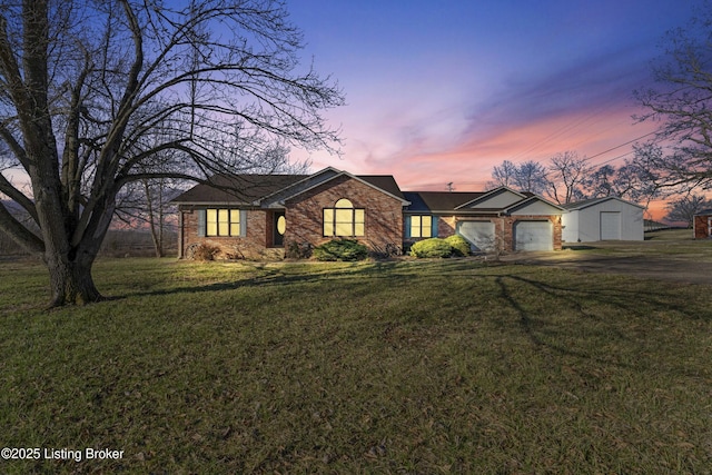 595 Centerview Dr, Shepherdsville, KY 40165 - view of front of home featuring asphalt driveway, an attached garage, brick siding, and a front yard
