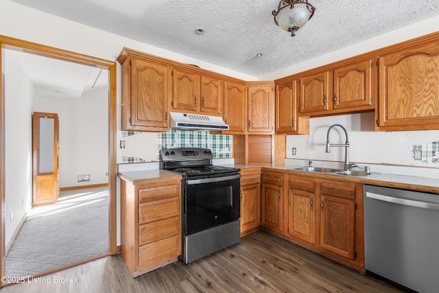 595 Centerview Dr, Shepherdsville, KY 40165 - kitchen with appliances with stainless steel finishes, under cabinet range hood, wood finished floors, and light countertops