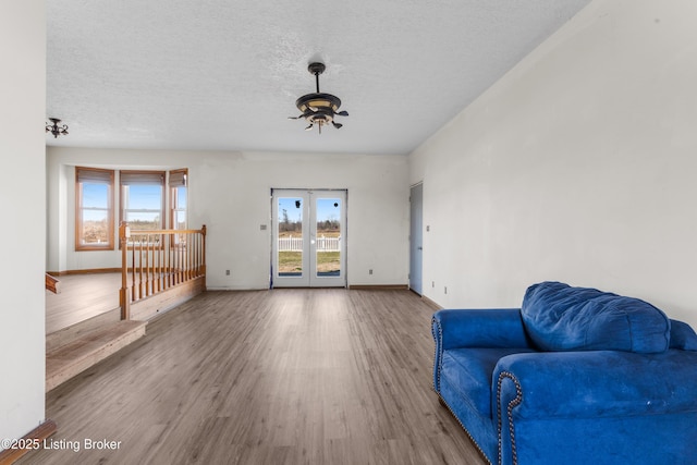 595 Centerview Dr, Shepherdsville, KY 40165 - sitting room with a ceiling fan, healthy amount of natural light, wood finished floors, a textured ceiling, and french doors