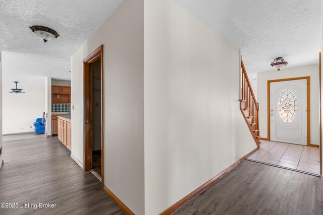 595 Centerview Dr, Shepherdsville, KY 40165 - hallway featuring a textured ceiling, wood finished floors, and stairway