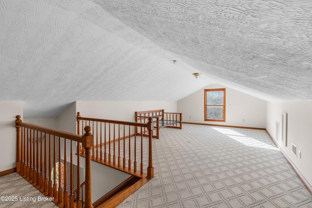 595 Centerview Dr, Shepherdsville, KY 40165 - additional living space with a textured ceiling, lofted ceiling, and carpet