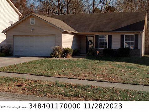 9511 Arrowridge Dr, Louisville, KY 40229 - single story home featuring an attached garage, a front lawn, and concrete driveway