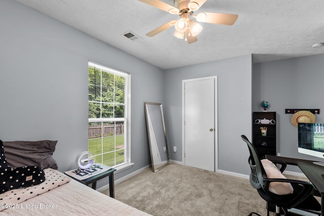 9511 Arrowridge Dr, Louisville, KY 40229 - carpeted bedroom with a textured ceiling, a ceiling fan, and a desk