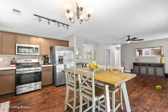 9511 Arrowridge Dr, Louisville, KY 40229 - kitchen with stainless steel appliances, dark wood-style floors, a ceiling fan, light countertops, and tasteful backsplash