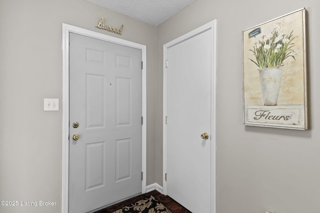 9511 Arrowridge Dr, Louisville, KY 40229 - foyer entrance featuring dark wood-style flooring and baseboards