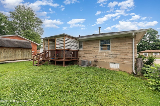 3806 Britt Ln, Louisville, KY 40219 - back of house featuring a wooden deck, a lawn, stone siding, and a storage shed