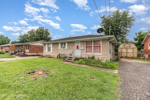 3806 Britt Ln, Louisville, KY 40219 - view of front of house with a shed and brick siding