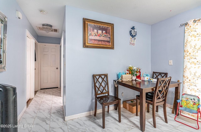3806 Britt Ln, Louisville, KY 40219 - dining room featuring light marble finish flooring and baseboards