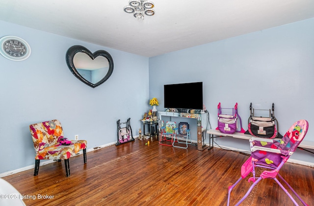 3806 Britt Ln, Louisville, KY 40219 - rec room with wood finished floors and baseboards