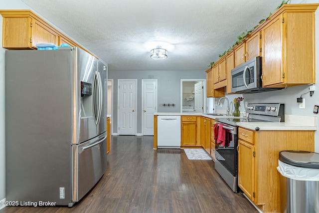 6102 Dalia Ct, Louisville, KY 40272 - kitchen with stainless steel appliances, dark wood-type flooring, light countertops, a peninsula, and a textured ceiling