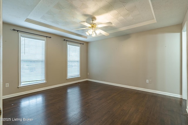 6102 Dalia Ct, Louisville, KY 40272 - empty room featuring dark wood-style flooring, a tray ceiling, a ceiling fan, and crown molding