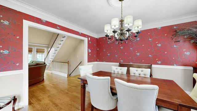 17217 Mallet Hill Dr, Louisville, KY 40245 - dining space featuring wainscoting, wallpapered walls, a chandelier, wood finished floors, and crown molding